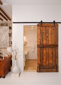 reclaimed-barn-door-adds-so-much-warmth-sleek-white