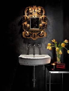 Mediterranean-powder-room-with-a-black-backdrop-and-stone-sink